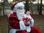 Robert sitting on Santa's lap for the first time